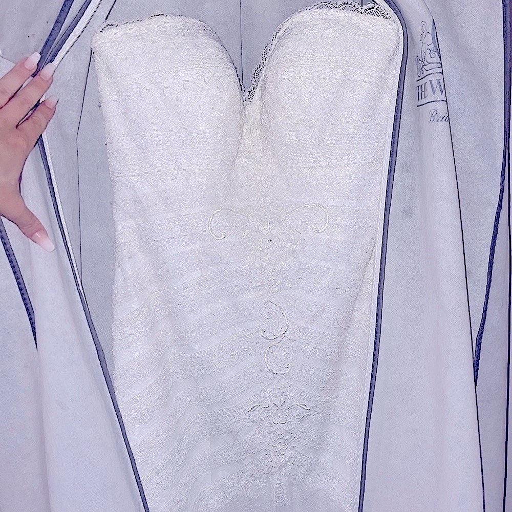 NWT designer wedding dress. Bought from “The White Dress” size 10 never altered